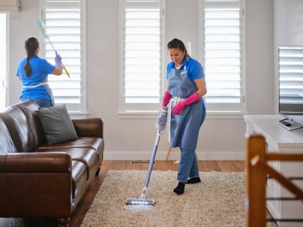professional housecleaning service at work in a home. professional housecleaning service at work in a home.