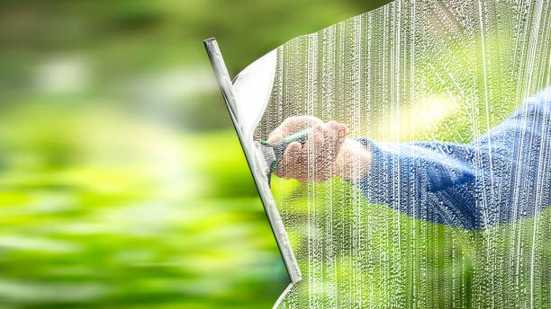 the window cleaner cleans the office windows the window cleaner cleans the office windows